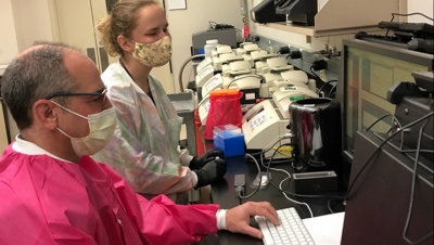 Research associate Lindsay Glang and senior bioinformatics analyst Gregory Rice sequencing SARS-CoV-2 genomes on Oxford Nanopore MinION platform at NMRC BDRD.