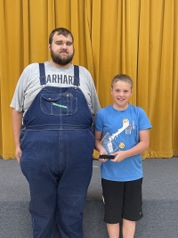 Pictured is Archery Coach Anthony Borden and Tripp McGowen
